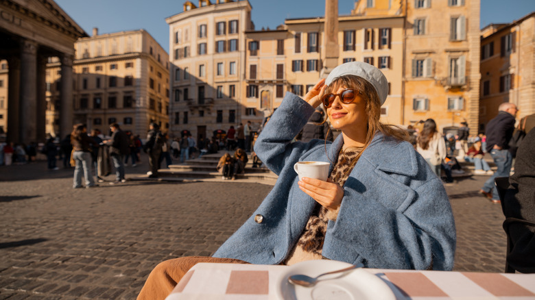 Woman enjoying a coffee in Rome