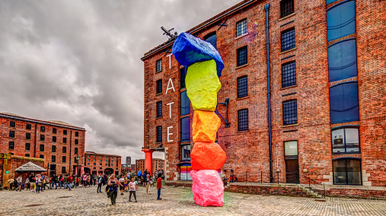 A colorful sculpture stands outside Tate Liverpool art gallery