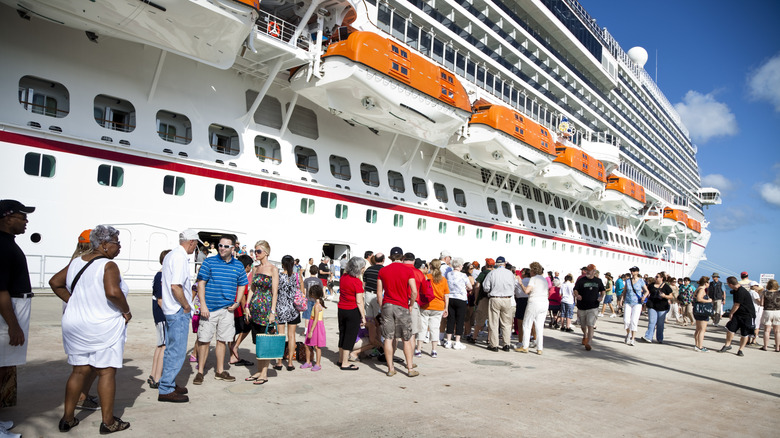 Docked cruise ship with waiting passengers