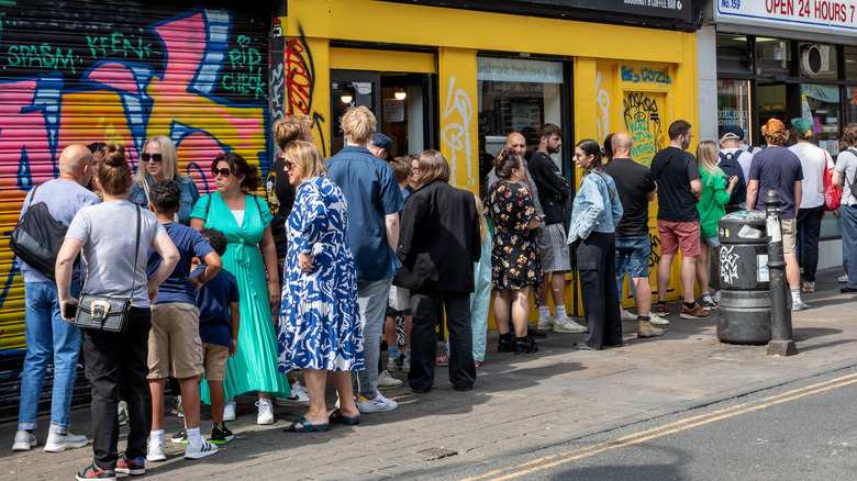 People waiting in line for a hot spot