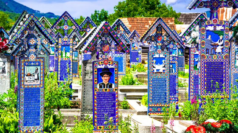 Brightly painted grave markers at Merry Cemetery, Romania