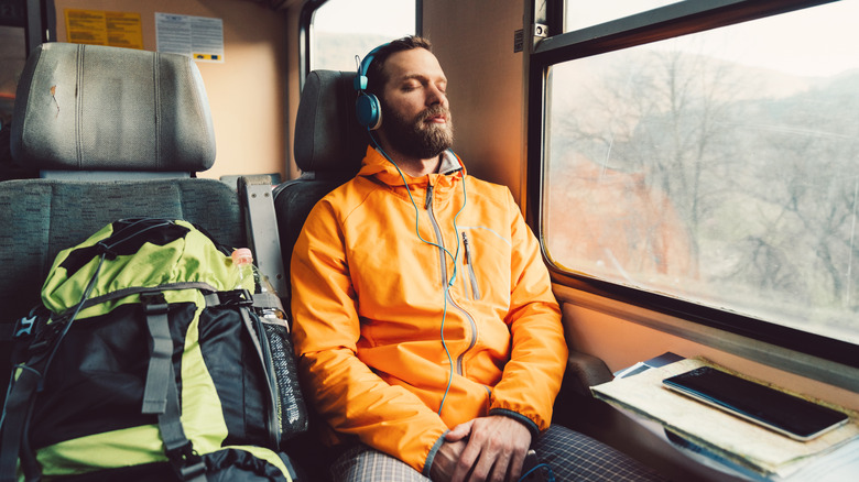 Person sleeping on a train