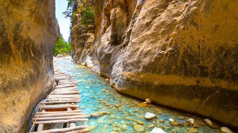 A wooden bridge path along the creek of Gorge of Samaria in Crete.