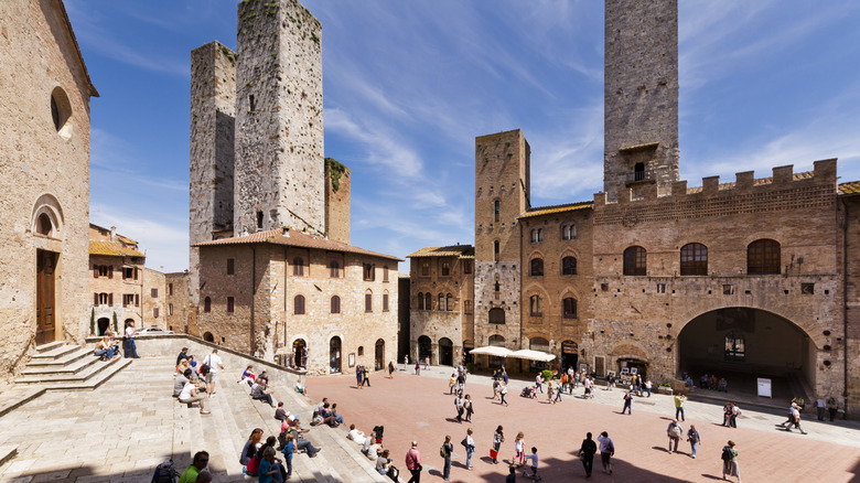 Tourists on Piazza del Duomo San Gimignano, Italy