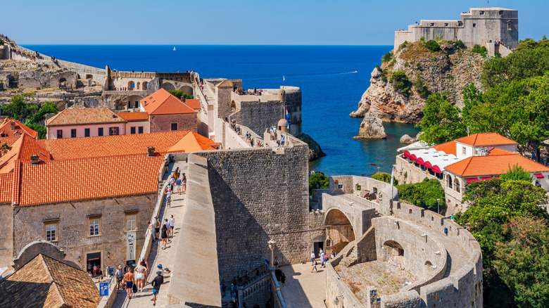 Tourists walking along the walls of Dubrovnik
