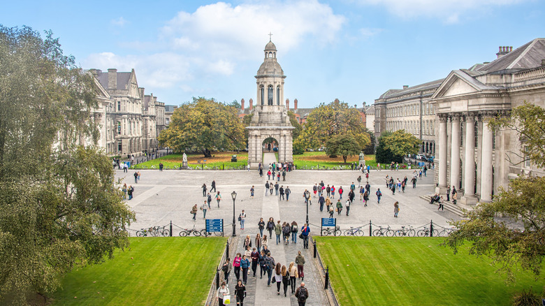 Courtyard filled with people at Trinity College in Dublin
