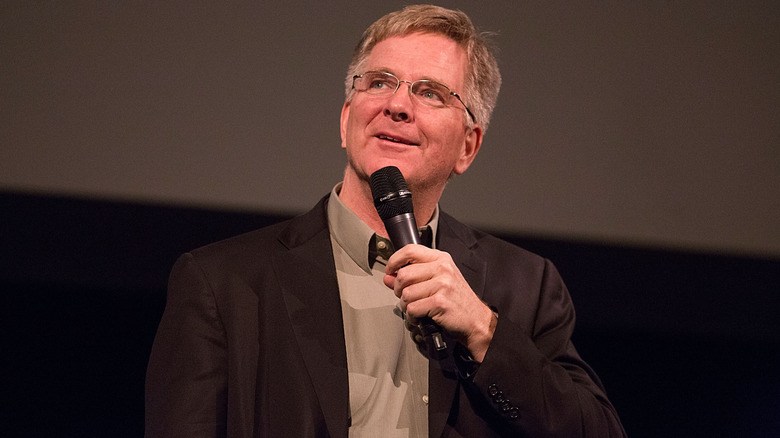 Rick Steves speaking on stage