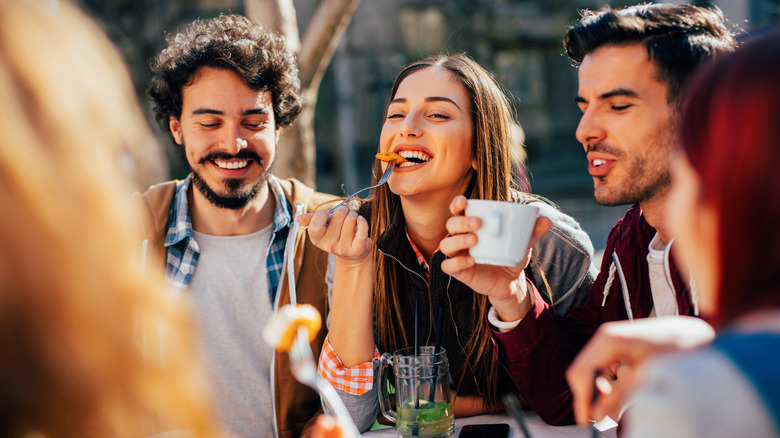 Friends eating a meal together