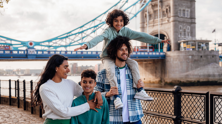Family walking near bridge in London