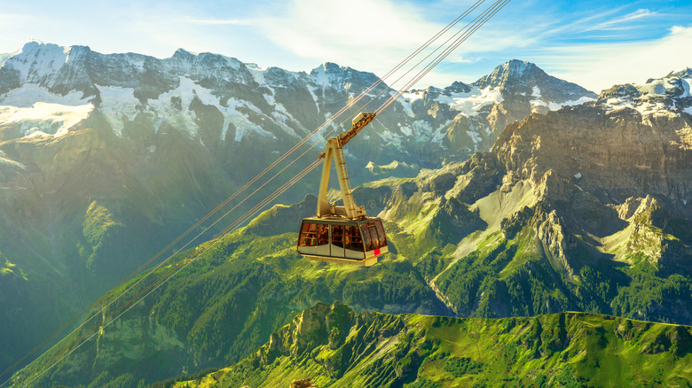 A cable car making its way up to Switzerland's Schilthorn peak in the summer