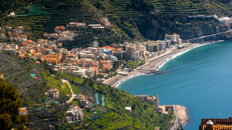 The beach, buildings, and hills in Maiori, Italy