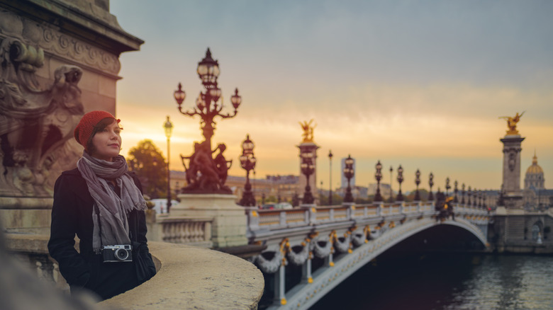 Woman at sunrise at Pont de la Concorde, Paris