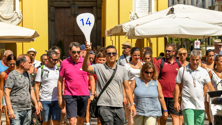 Tour guide with a group of tourists in Sorrento, Italy