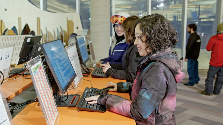 People at a rental shop using public computers