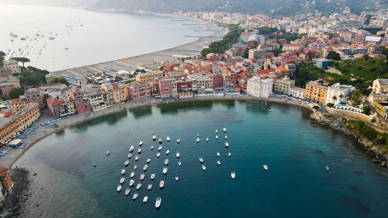 Boats dot the water of a beach in Sestri Levante