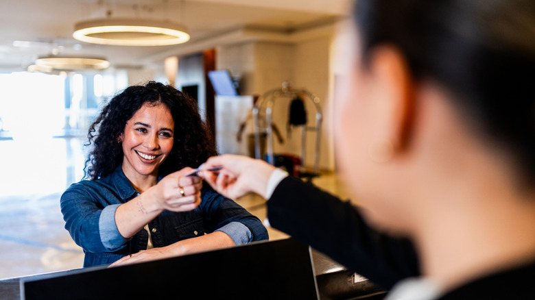 Woman checking into a hotel