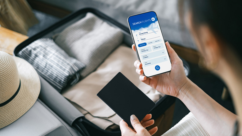 Woman searching for flights on her phone