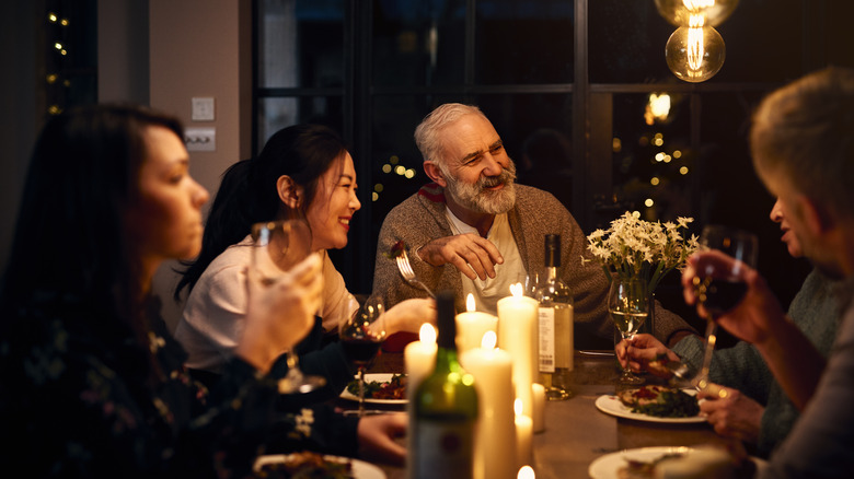 Lively conversation at a dinner table