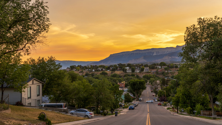 Cars line the streets of Rifle, Colorado, below the Rocky Mountains