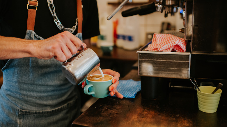 Barista making a latte coffee