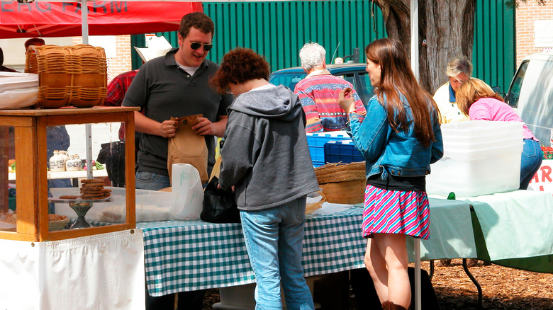 Two women at a farmer's market booth