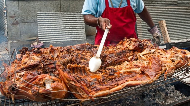 Rodney Scott's BBQ grilling and smoking a whole hog in Charleston, South Carolina.