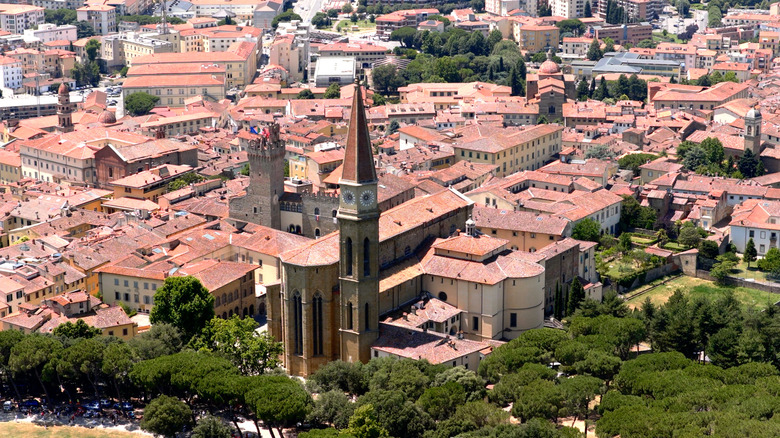 Aerial view of buildings, rooftops, and a church in Arezzo, Tuscany