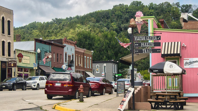 Old buildings, cars, and signs for a visitor's center in Lanesboro in the Root River Valley, MN