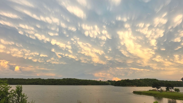 Storm clouds and sunset over Pony Creek Lake north of Sabetha, Kansas.