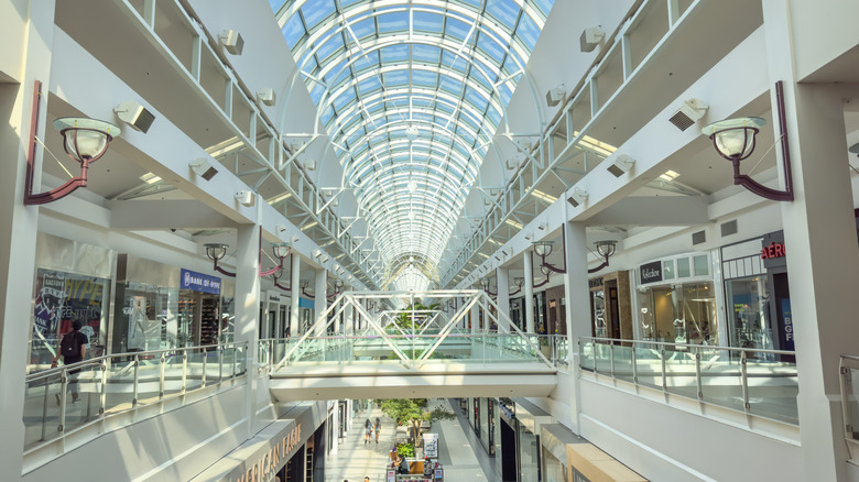 Arden Fair mall in Sacramento in the morning with skylights and a skybridge.