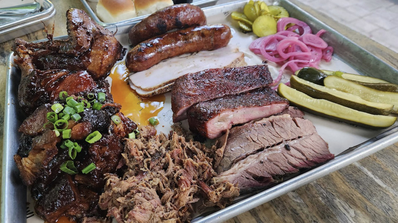 Tray with different kinds of meat, pickles and onions from Urban Roots