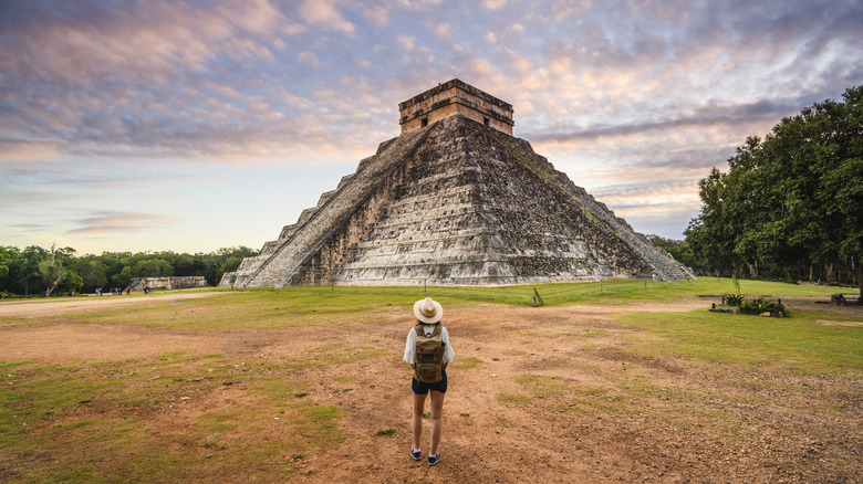 Single traveler in front of a Mayan temple