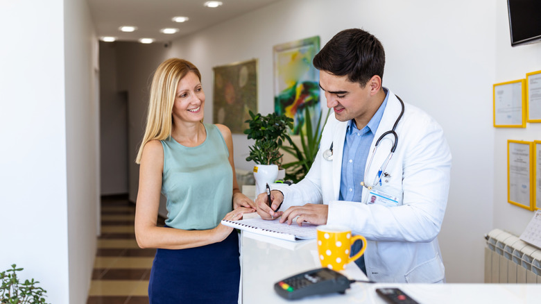 Woman consulting a doctor in a clinic