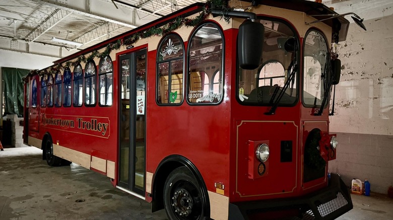 A red Quakertown Trolley used for trolley tours in Salem, Ohio.