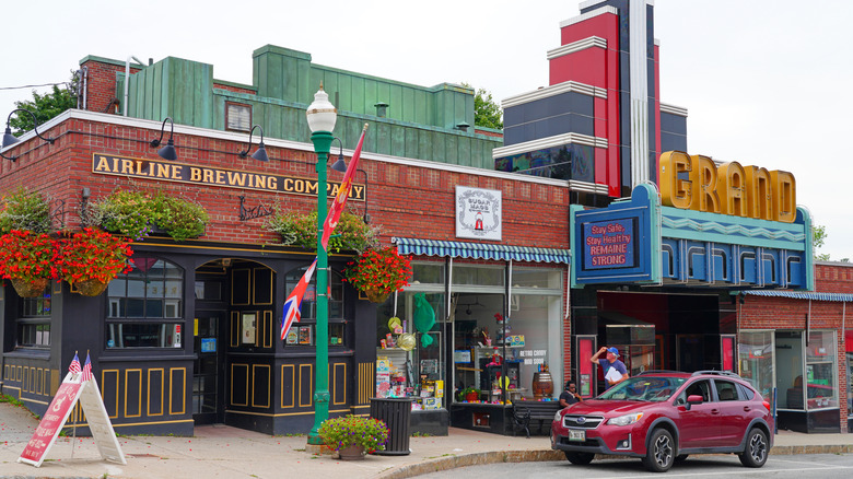 A building with a car parked in front in downtown Ellsworth, Maine