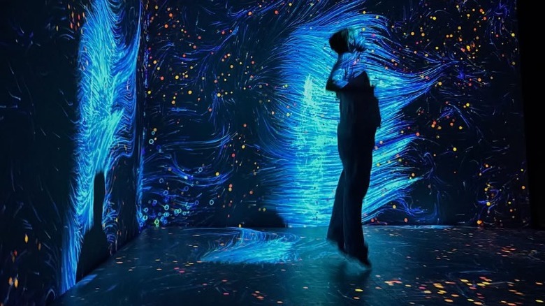 Woman posing in front of light desplay at HopScotch San Antonio