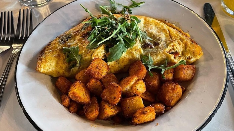 Omelette and potatoes from Nola Brunch and Beignets