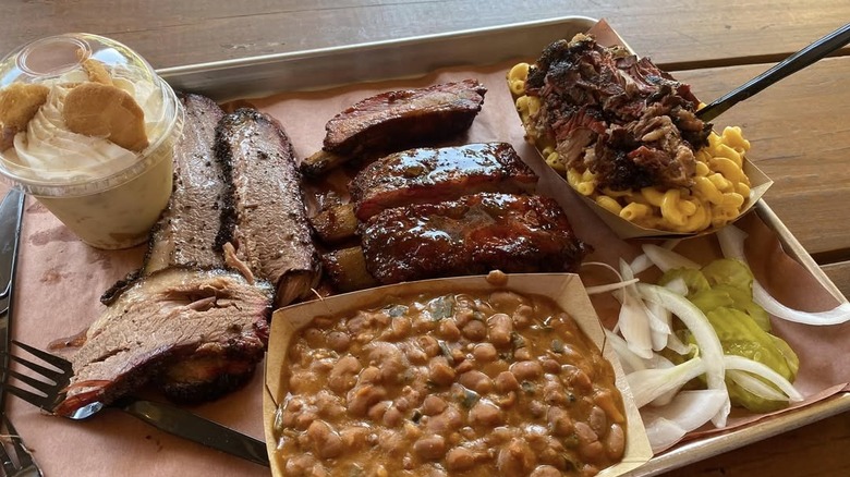Tray with ribs, meat, beans, and mac and cheese from Pinkerton's Barbecue