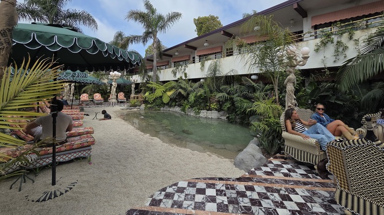 Guests enjoy the sandy pool area at the Baby Grand Hotel, San Diego, CA.