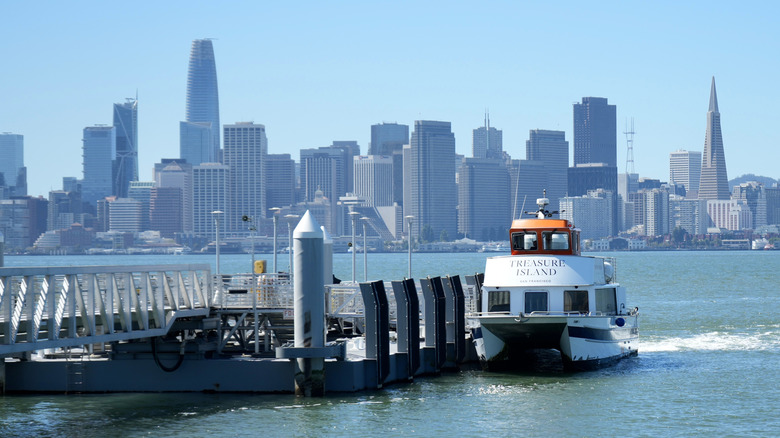 The Treasure Island Ferry on Treasure Island with San Francisco Skyline behind.