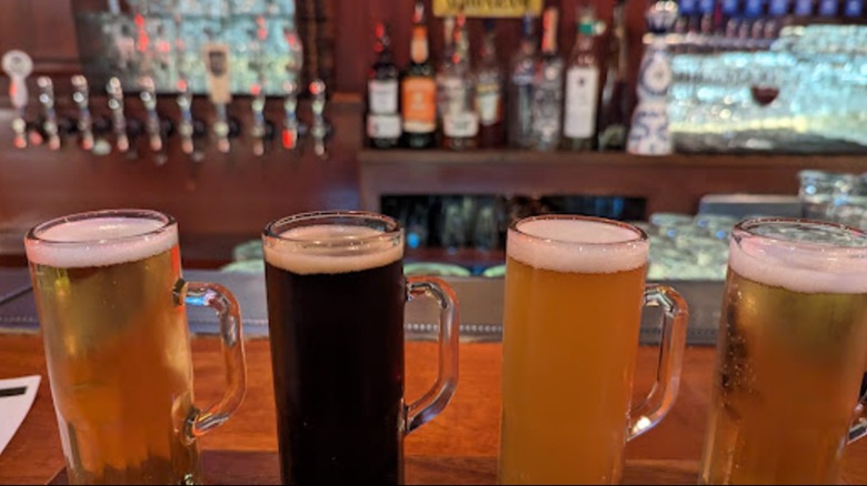 A beer flight arranged on the wooden bar at Schroeder's in San Francisco