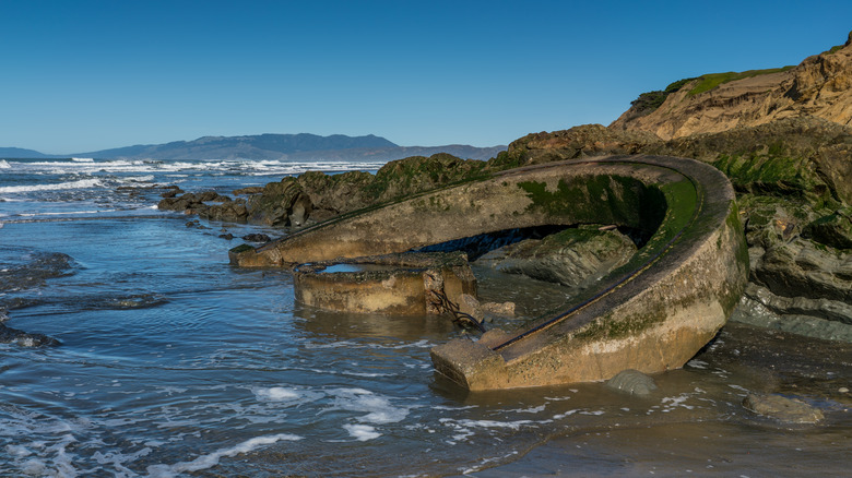 Eroded gun turret in the sea at Fort Funston