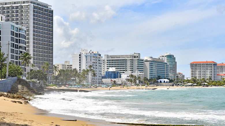 Waves lapping on Condado Beach, lined with buildings