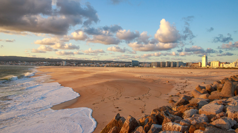 Powdery sand beach in Figueira da Foz with city backdrop