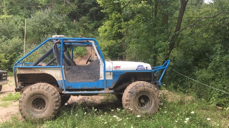 An off-road vehicle parked in The Cliffs Insane Terrain Off-Road Park in Marseilles, Illinois