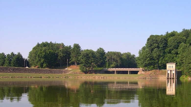 A bridge and trees behind Clendening Lake in Ohio