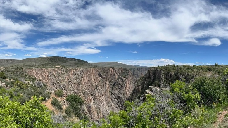 Cloudy blue skies over Black Canyon in Montrose, Colorado