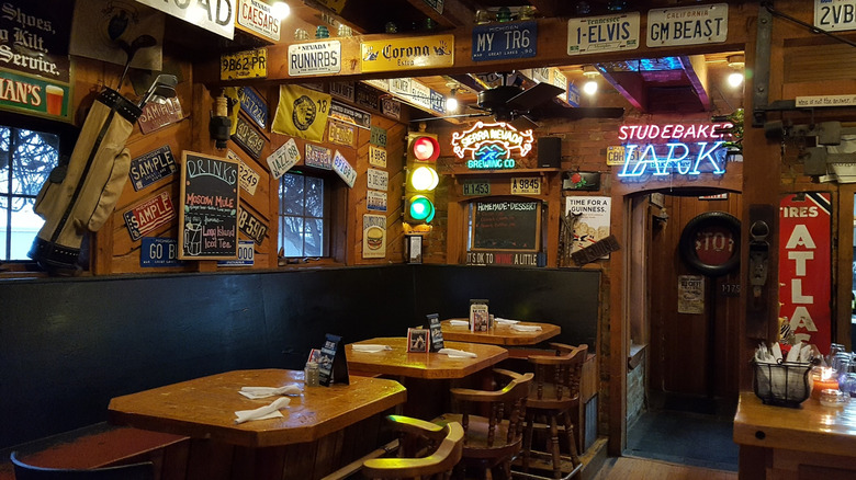 Interior of Rosalie's Roadhouse with booths, eclectic signage, and decor