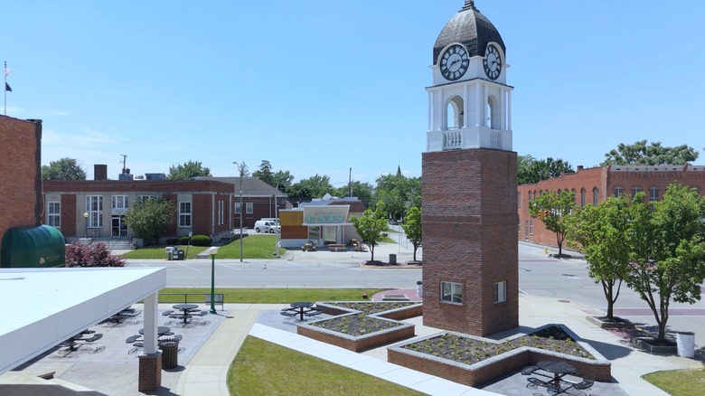 Downtown Willard, Ohio, complete with a clock tower, outdoor seating area, and businesses