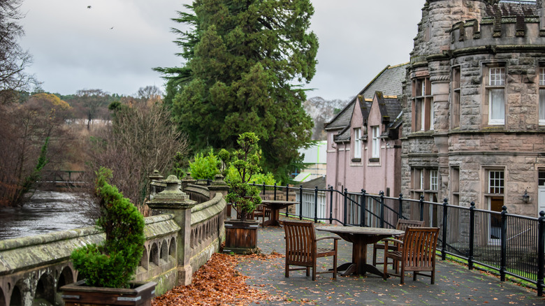 A patio along the river and near historic buildings in Elgin, Scotland